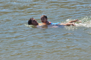 Quinn swimming with her daddy