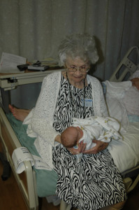 Holding newborn Parker